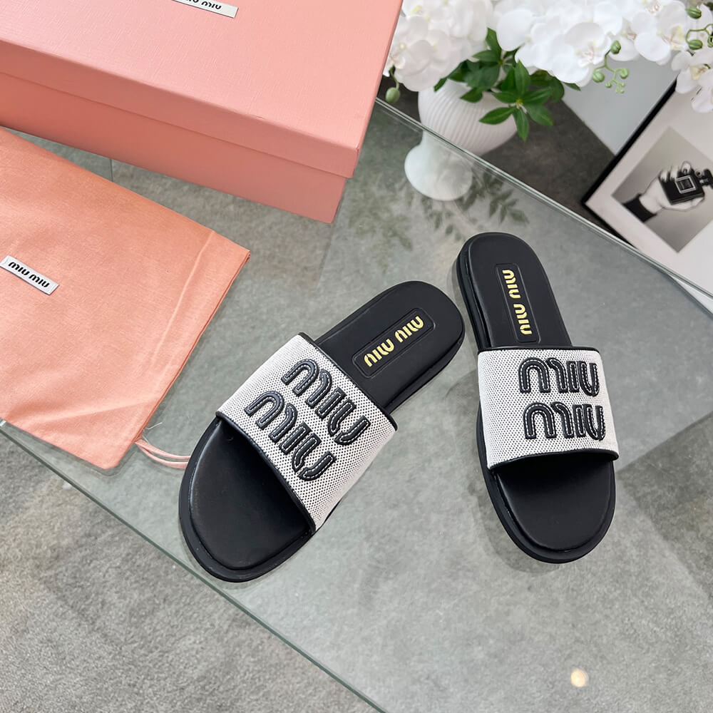 MiuMiu Canvas and leather slides